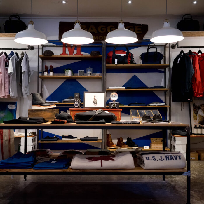 A clothing store with a lot of items on the shelves.